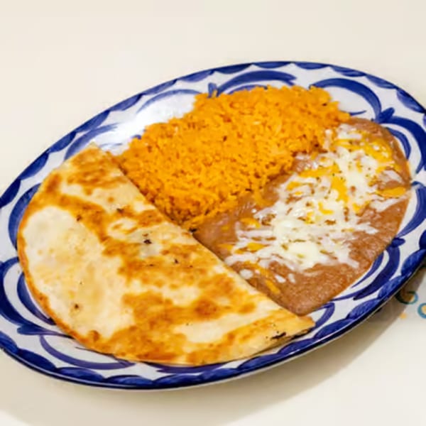 A quesadilla, refried beans with melted cheese, and orange rice on a blue and white patterned plate.